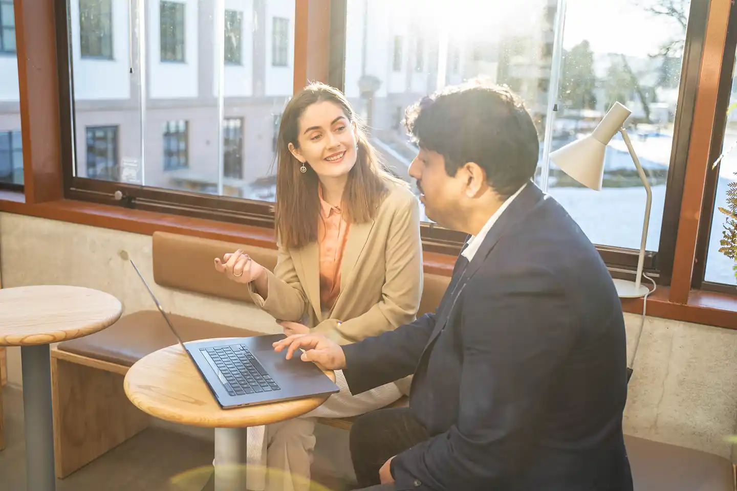 Man and woman discussing XaitCPQ implementation